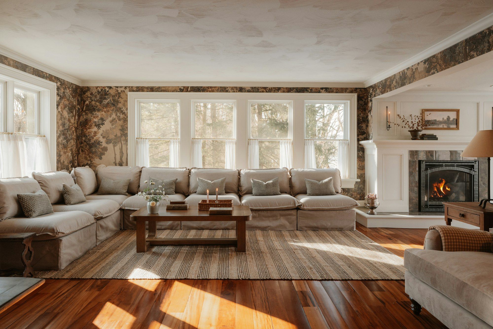 Bright living room with a sectional sofa and a fireplace